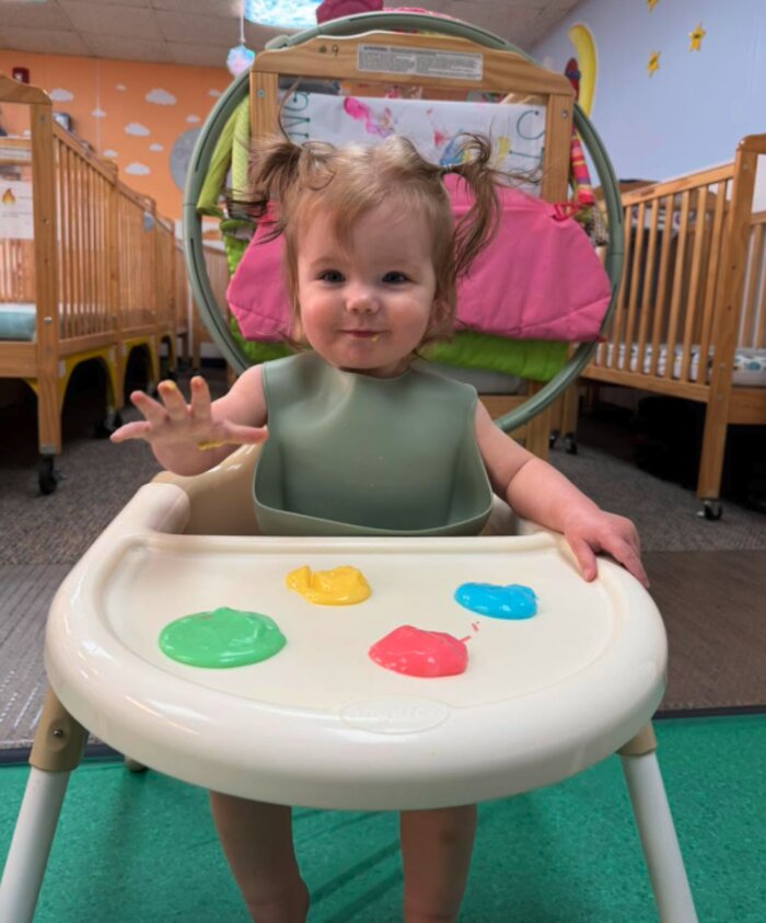 Infant exploring a sensory activity