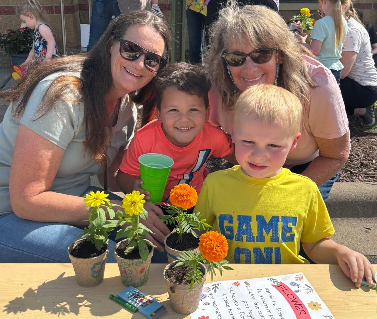 Families celebrating together at a Creative Kids Academy family event