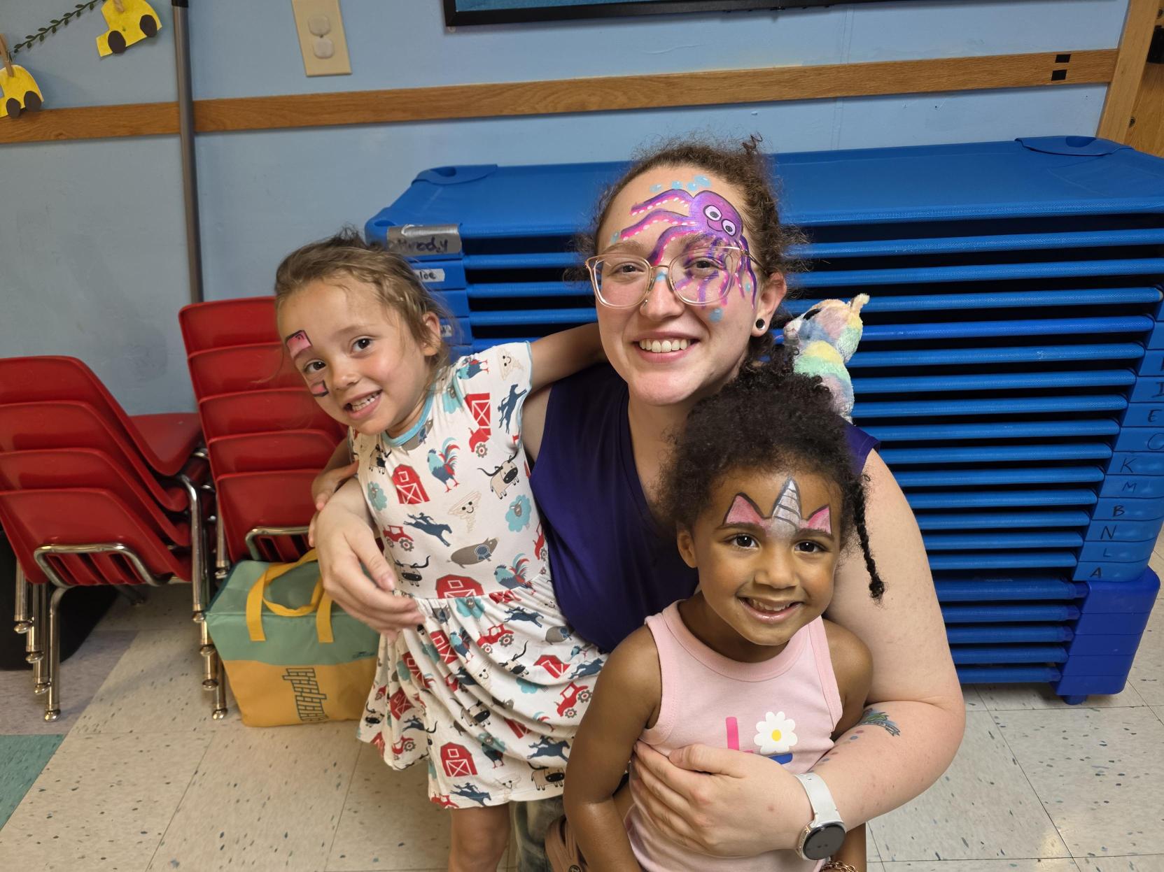 CKA teacher sharing a hug with a young child