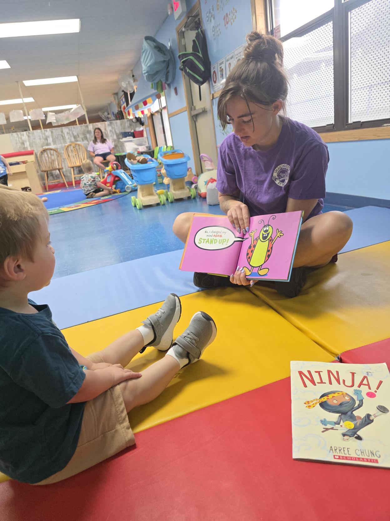 CKA teacher reading with children