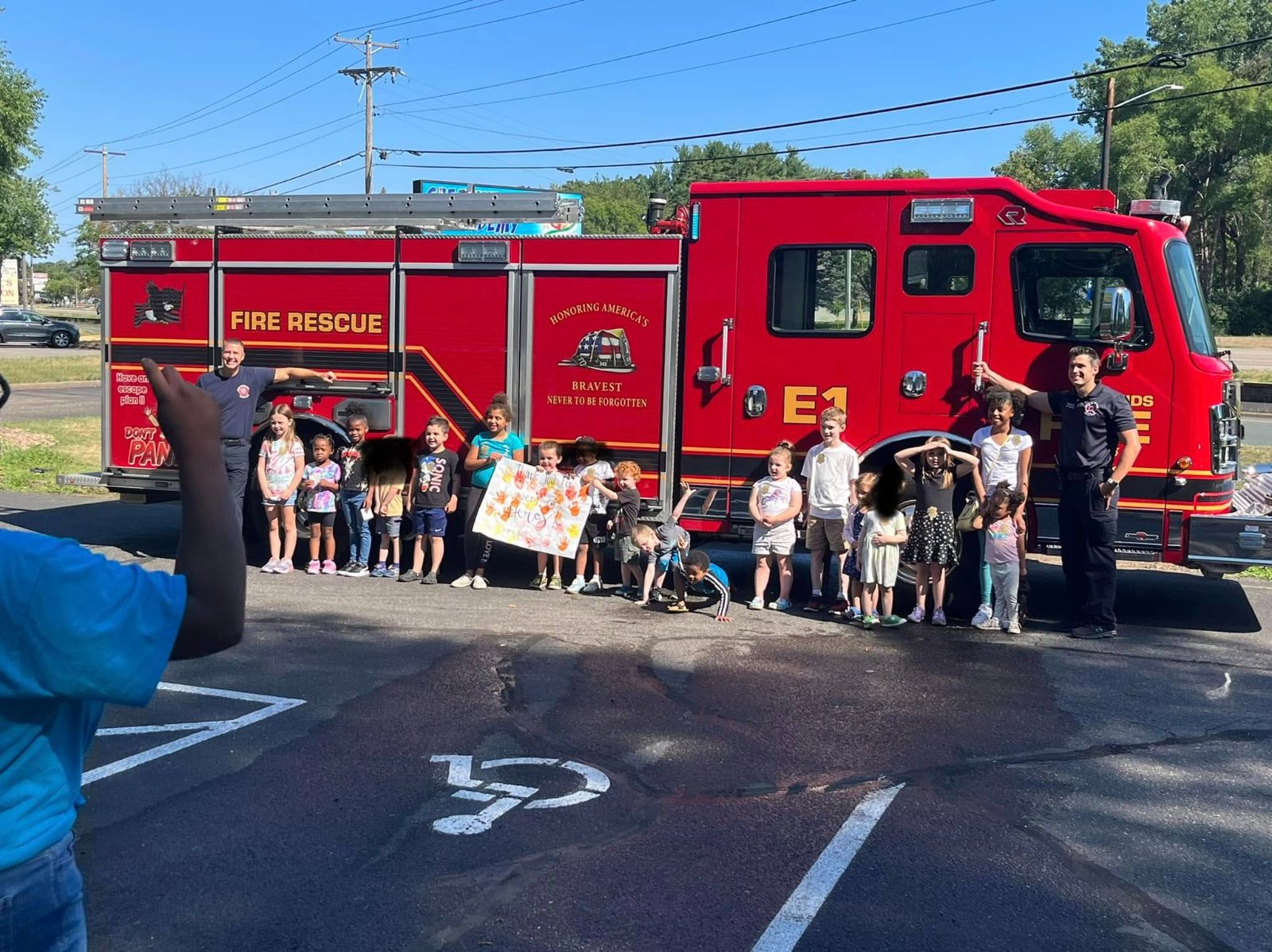 Firefighters visiting the children at Creative Kids Academy Coon Rapids