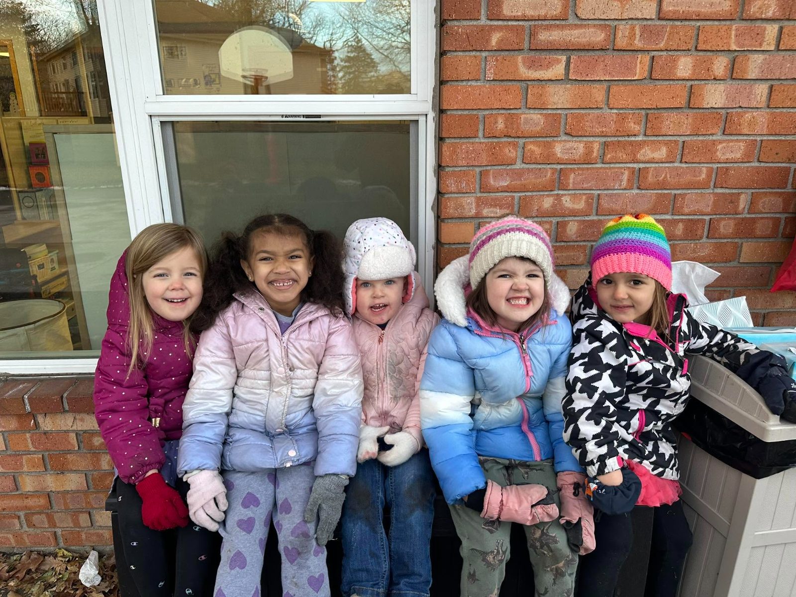 Preschool friends bundled up for winter outdoor play