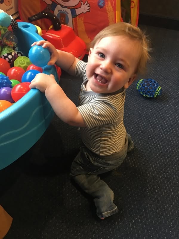 A toddler playing at the ball pit at Creative Kids Academy Minnetonka