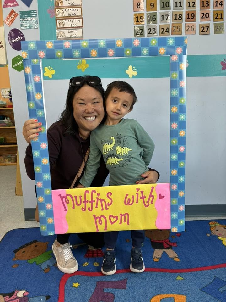 A mom and her son celebrating together at our Muffins with Mom event at Creative Kids Academy Elk River