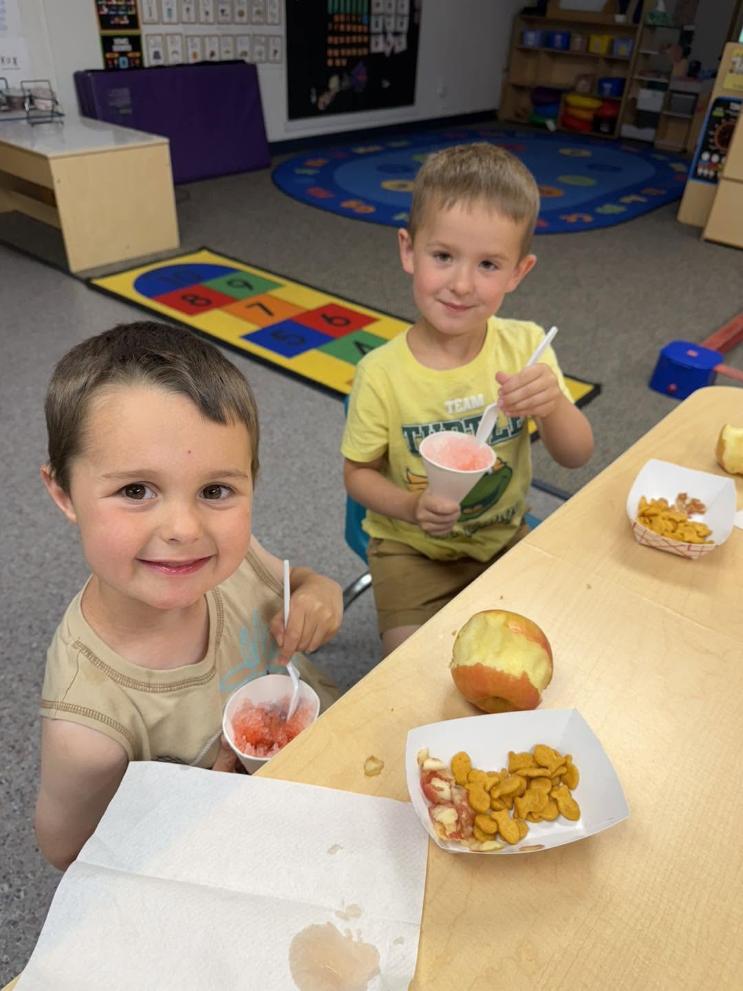 Children eating a snack at the table
