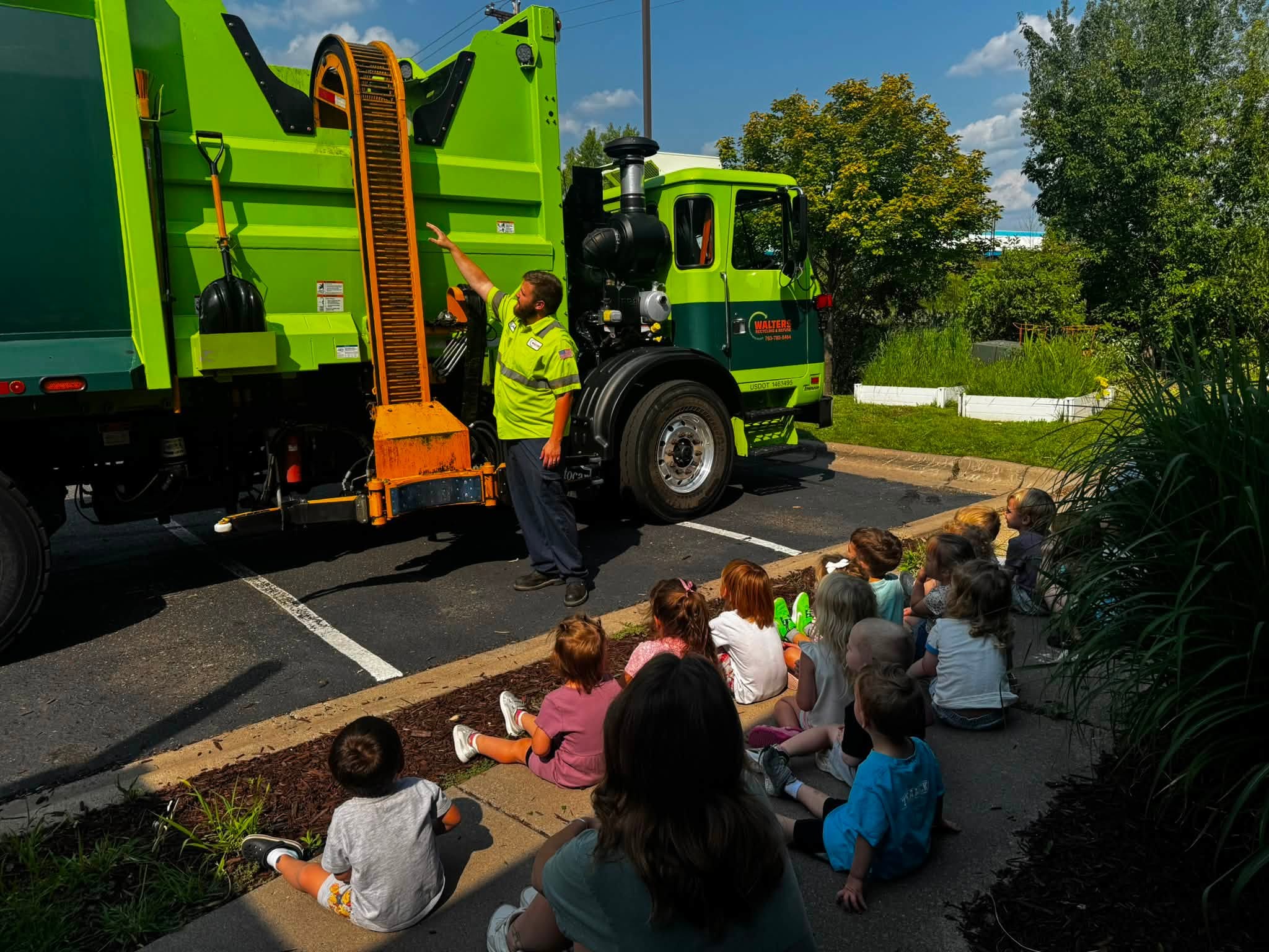 Children watching a visiting truck