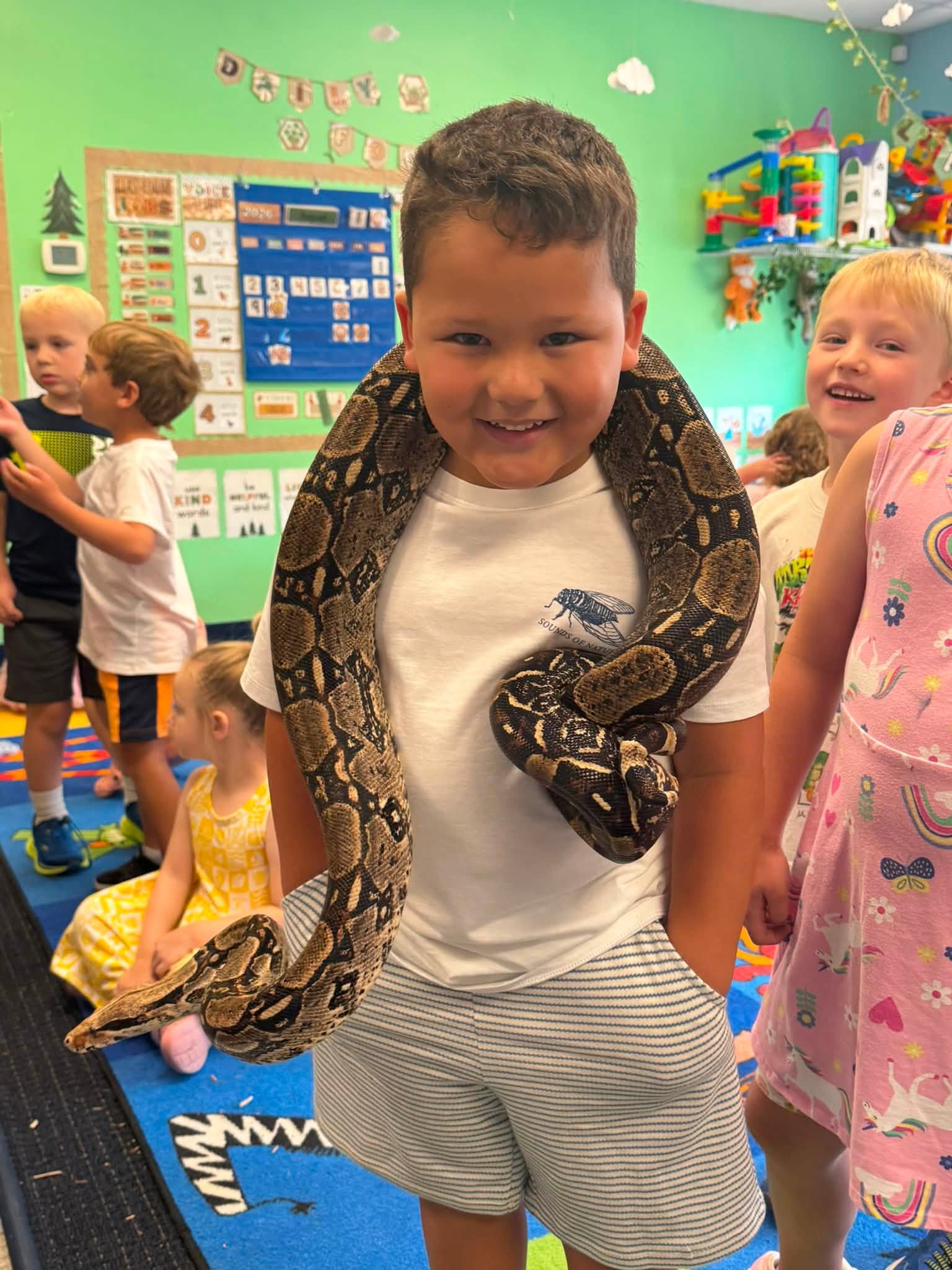 Preschoolers meeting a snake during a science visit