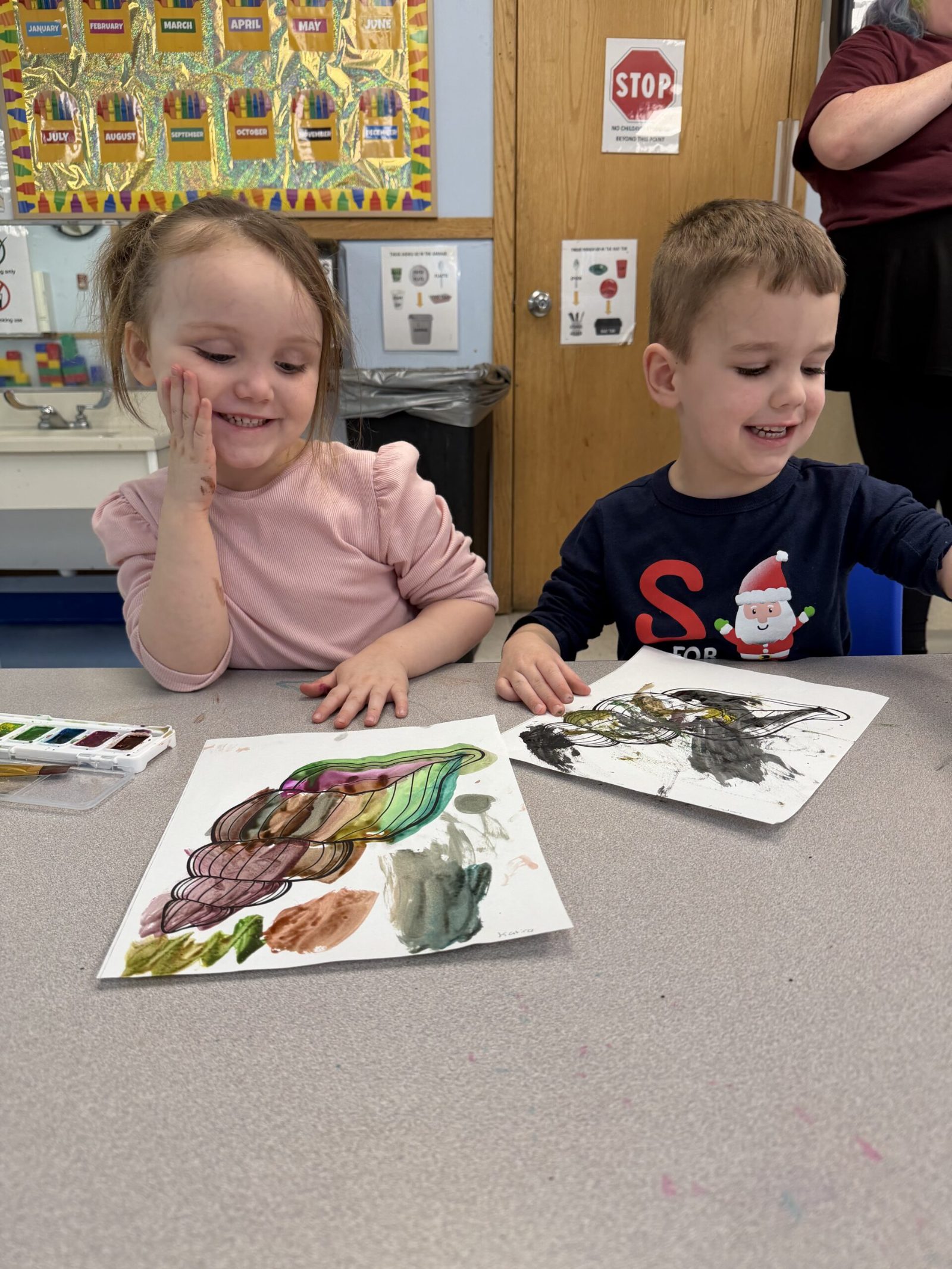 Preschoolers painting with watercolors