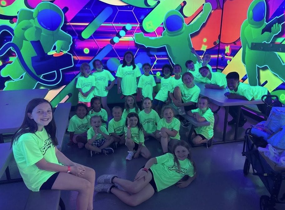 School-age kids at a glow trampoline park