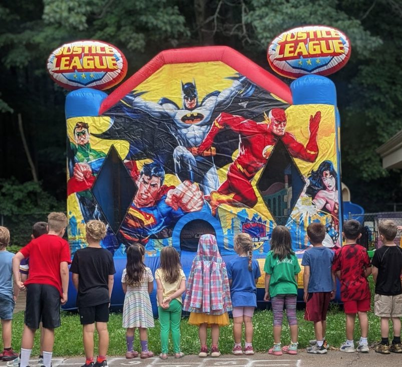 CKA kids dressed as superheroes for a summer theme day